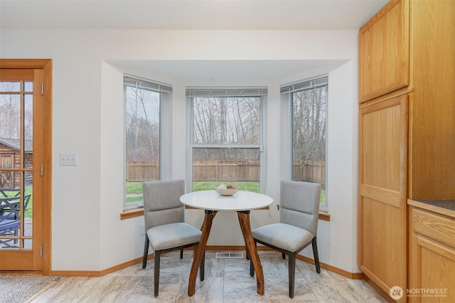 sitting room with visible vents and baseboards