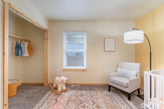 carpeted bedroom with a closet, visible vents, and baseboards