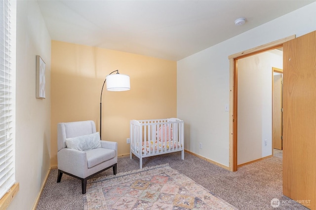 carpeted bedroom with baseboards