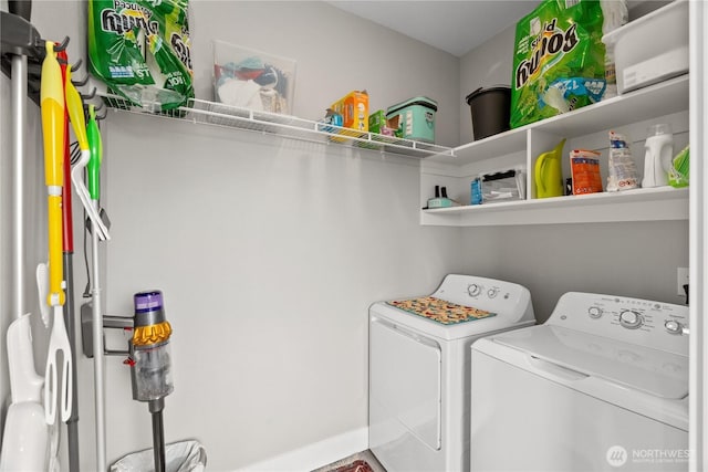 laundry area with washing machine and clothes dryer and laundry area