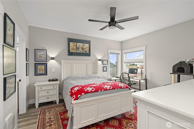 bedroom with visible vents, ceiling fan, and wood finished floors