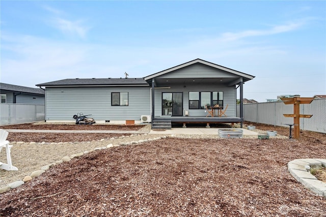 rear view of house with fence