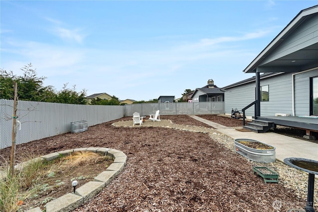 view of yard featuring a patio area and a fenced backyard