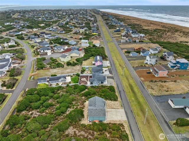 aerial view with a beach view, a residential view, and a water view