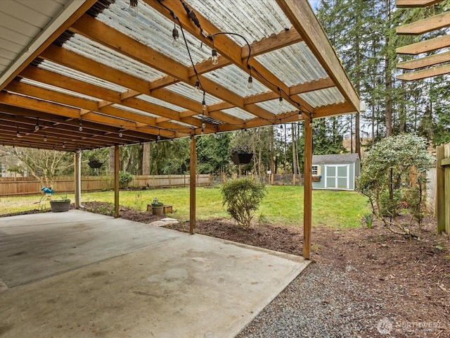 view of patio / terrace featuring a fenced backyard, a shed, and an outdoor structure