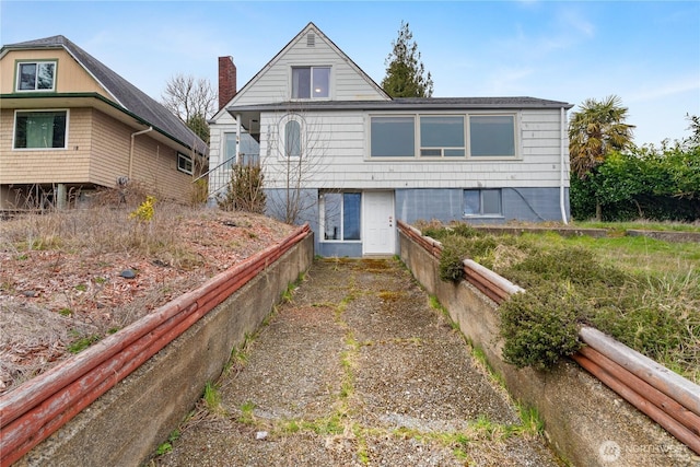 view of front of property with a chimney