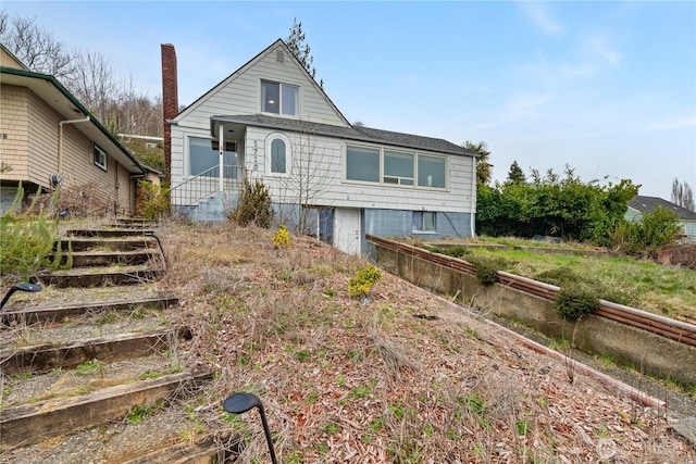 view of front of house with a chimney