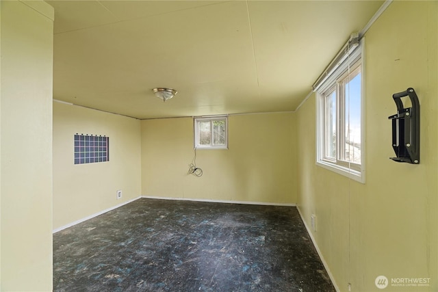 spare room featuring baseboards