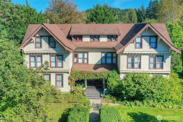 view of front of home with a chimney