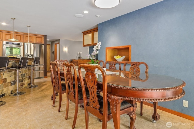 dining area featuring recessed lighting