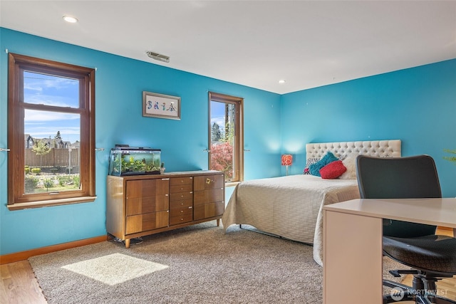 bedroom with recessed lighting, visible vents, and baseboards