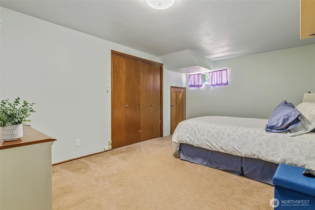 carpeted bedroom with a closet