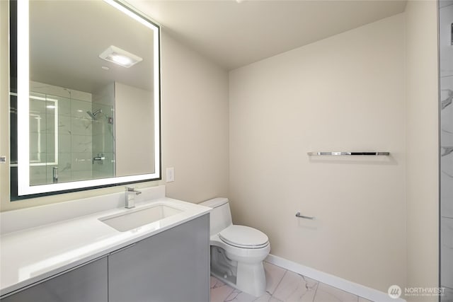 full bath with toilet, marble finish floor, tiled shower, baseboards, and vanity