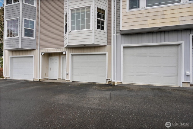 garage featuring aphalt driveway