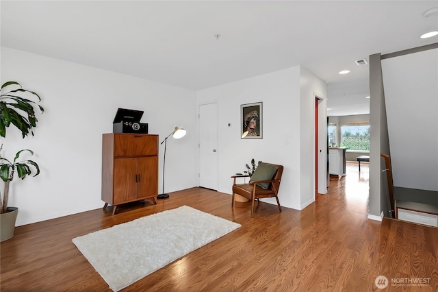 entryway with recessed lighting, wood finished floors, and baseboards