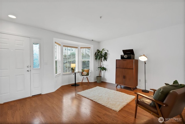 entrance foyer with wood finished floors and baseboards