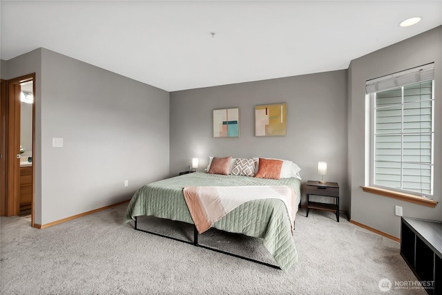 carpeted bedroom featuring baseboards