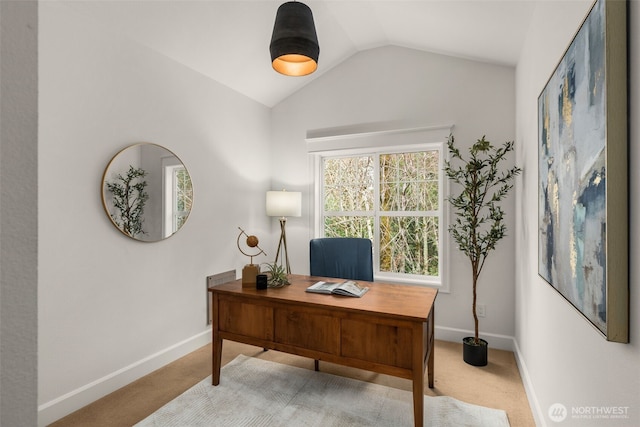 carpeted office with baseboards and vaulted ceiling