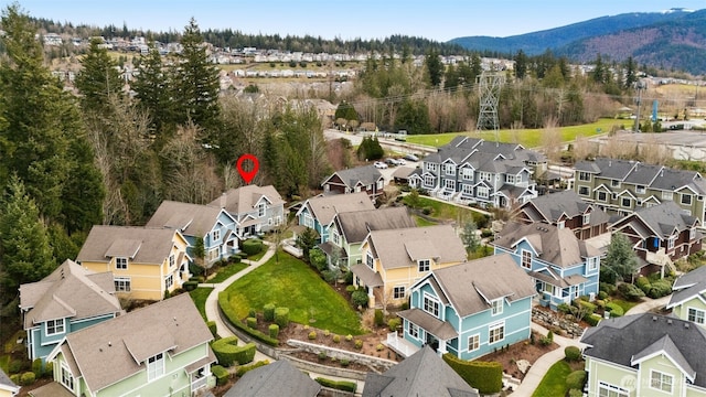 drone / aerial view featuring a mountain view and a residential view