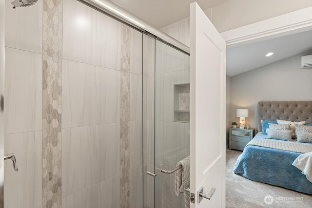 ensuite bathroom featuring recessed lighting, connected bathroom, a stall shower, and a wall unit AC