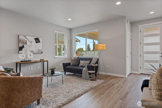 sitting room with recessed lighting, wood finished floors, and baseboards