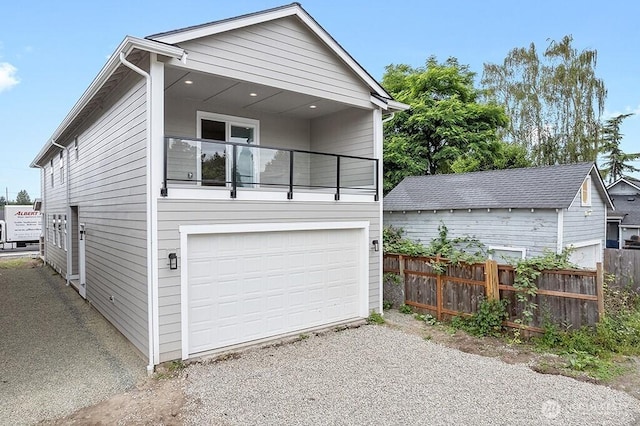 garage with fence