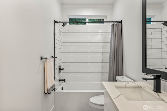 bathroom featuring shower / bath combination with curtain, toilet, and vanity