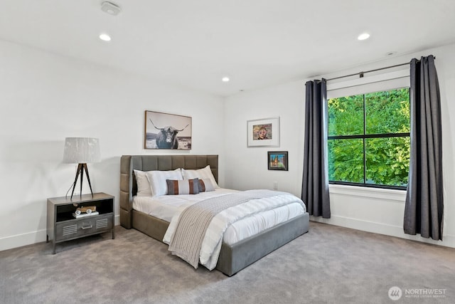 carpeted bedroom featuring recessed lighting and baseboards