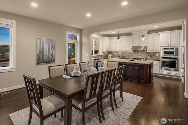 dining room featuring dark wood-type flooring, recessed lighting, and visible vents