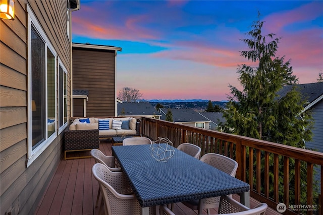 deck featuring outdoor dining area and an outdoor hangout area