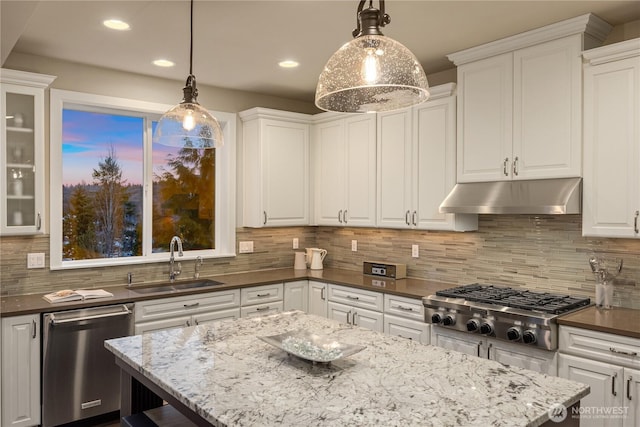 kitchen featuring a sink, decorative backsplash, stainless steel appliances, under cabinet range hood, and white cabinetry