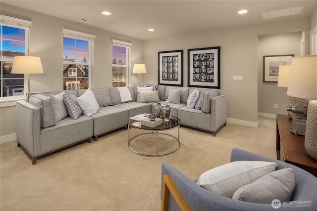 living room with recessed lighting, visible vents, and baseboards