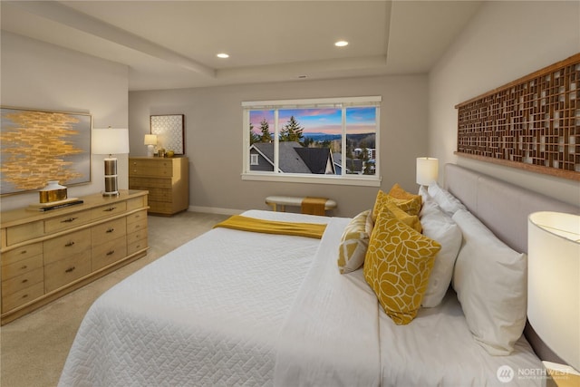 bedroom featuring recessed lighting, baseboards, a raised ceiling, and light carpet