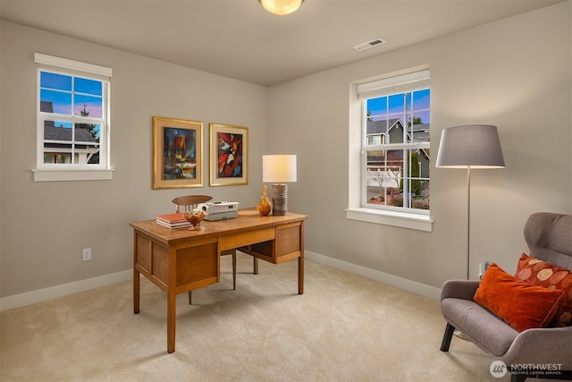 office area featuring visible vents, baseboards, and carpet floors