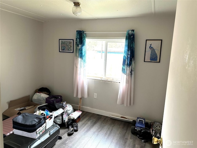 misc room with dark wood finished floors and baseboards