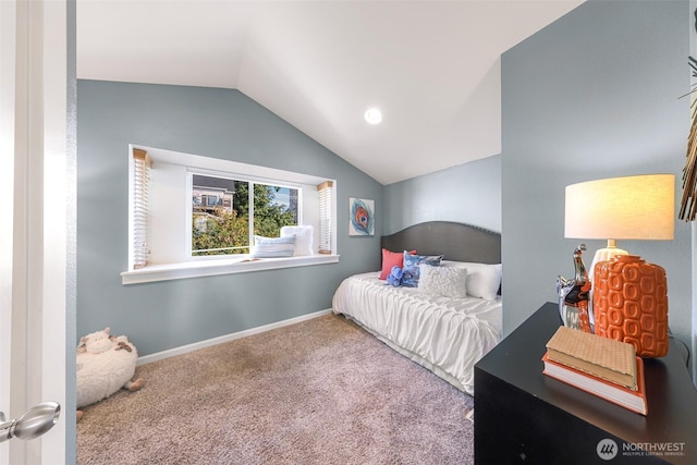 bedroom featuring vaulted ceiling, carpet flooring, and baseboards