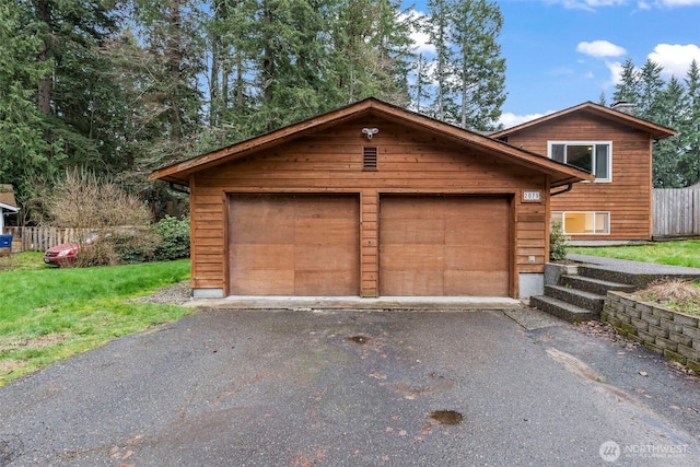 garage with fence