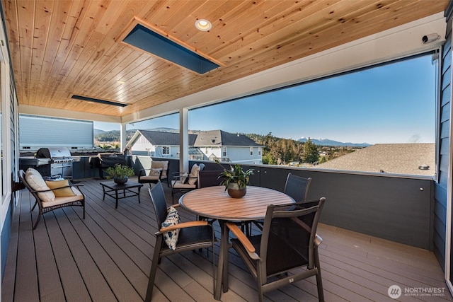 30 Sundae Dr, Sequim, WA 98382 - wooden terrace with outdoor dining area, a mountain view, and grilling area