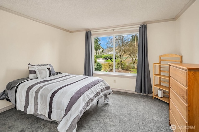 bedroom with a textured ceiling, ornamental molding, and carpet flooring