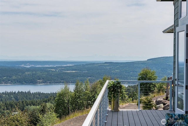 balcony with a view of trees and a water view