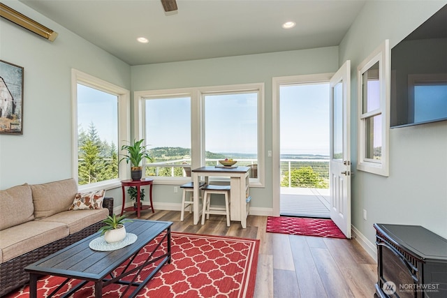 sunroom / solarium featuring plenty of natural light