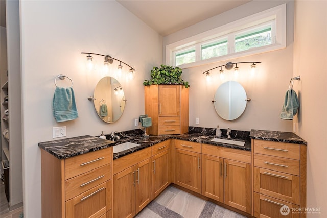 full bath featuring double vanity and a sink