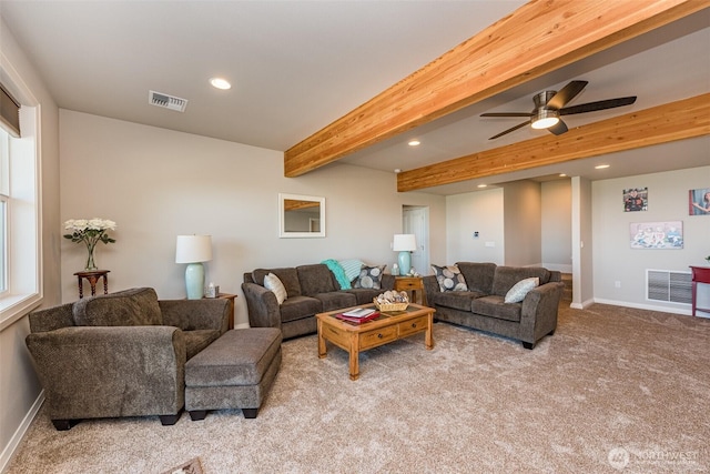 living area featuring visible vents, baseboards, beam ceiling, recessed lighting, and light carpet