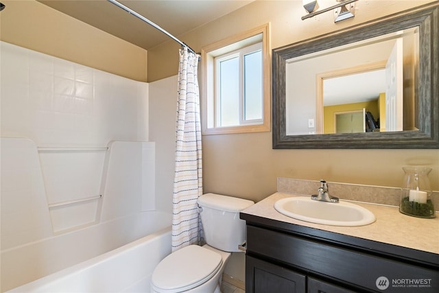 bathroom with vanity, toilet, and shower / bath combo with shower curtain