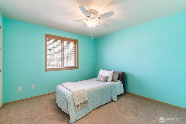 bedroom featuring baseboards, carpet floors, and ceiling fan