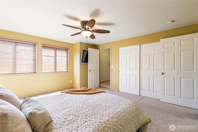 bedroom featuring a closet, carpet flooring, and ceiling fan