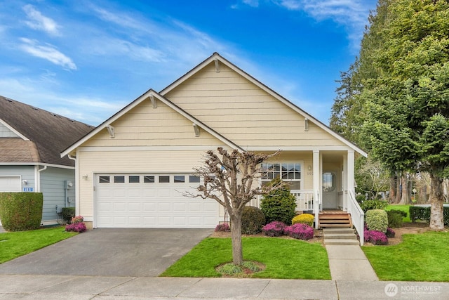 view of front of home with an attached garage, a front lawn, a porch, and driveway