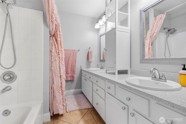 bathroom with tile patterned floors, double vanity, shower / bath combo, and a sink