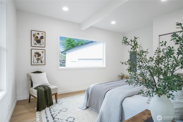 bedroom featuring beamed ceiling, recessed lighting, light wood-type flooring, and baseboards