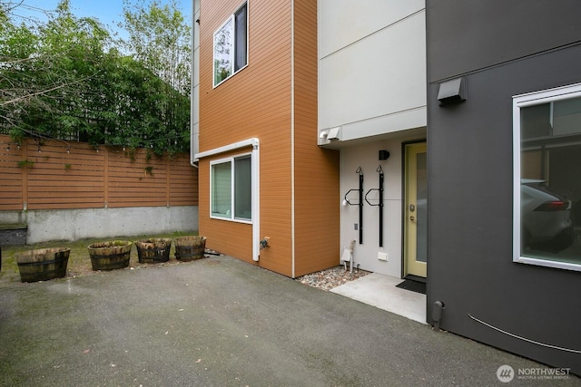 exterior space featuring a patio area and fence